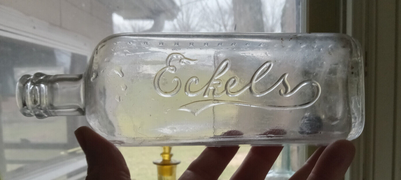 ECKELS EMBALMING FLUID BOTTLE WITH MEASUREMENTS USED BY UNDERTAKER FOR DEAD BODY