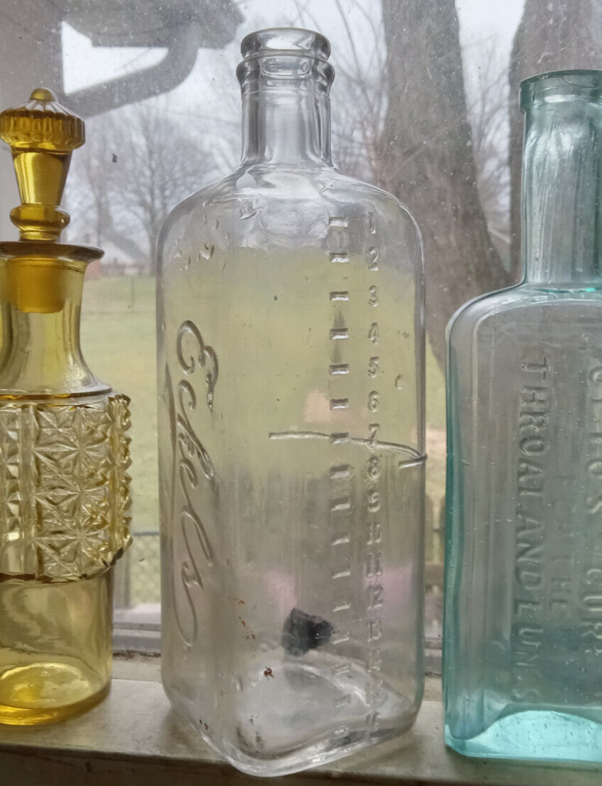 ECKELS EMBALMING FLUID BOTTLE WITH MEASUREMENTS USED BY UNDERTAKER FOR DEAD BODY